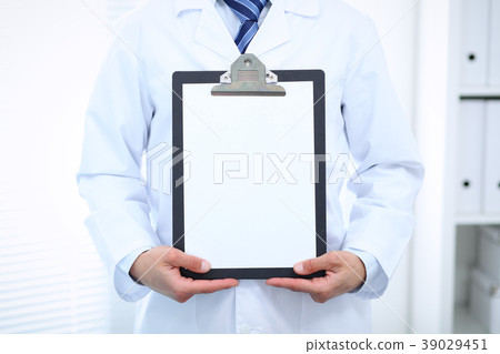 Unknown male doctor standing straight while 39029451