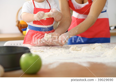 Mother and her cute daughter hands prepares the Mother and her cute daughter hands prepares the 39029690