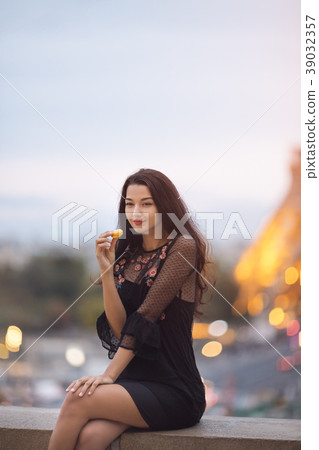 Paris woman smiling eating the french pastry Paris woman smiling eating the french pastry 39032357