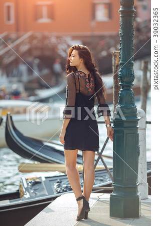 Travel tourist woman on pier against beautiful Travel tourist woman on pier against beautiful 39032365