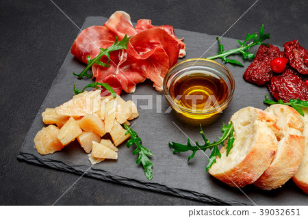 Traditional italian meals - prosciutto crudo or Traditional italian meals - prosciutto crudo or 39032651