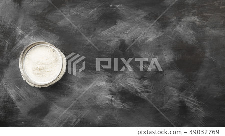 Sieve with flour on dark background. Top view Sieve with flour on dark background. Top view 39032769
