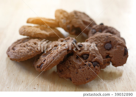 Chocolate cookies on wooden table. Chocolate cookies on wooden table. 39032890