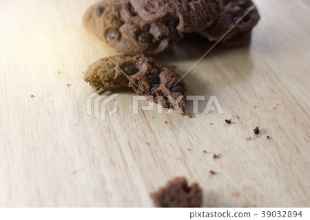 Chocolate cookies on wooden table. Chocolate cookies on wooden table. 39032894