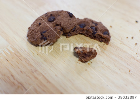 Chocolate cookies on wooden table.  39032897