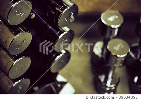 Closeup image of chrome dumbbells 39034055