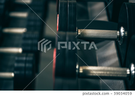 Closeup image of chrome dumbbells Closeup image of chrome dumbbells 39034059