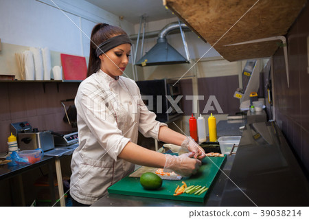 a girl prepares food sushi 39038214