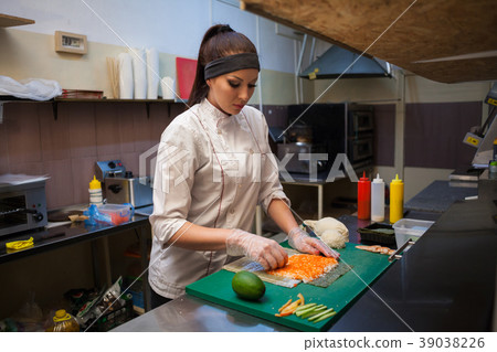 a girl prepares food sushi 39038226