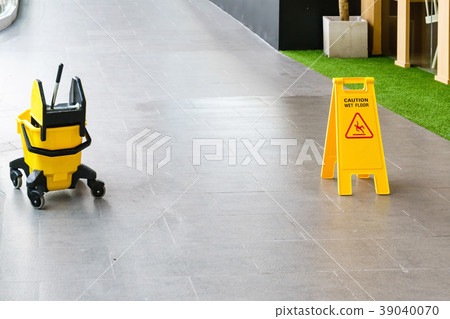 Sign showing warning of caution wet floor Sign showing warning of caution wet floor 39040070