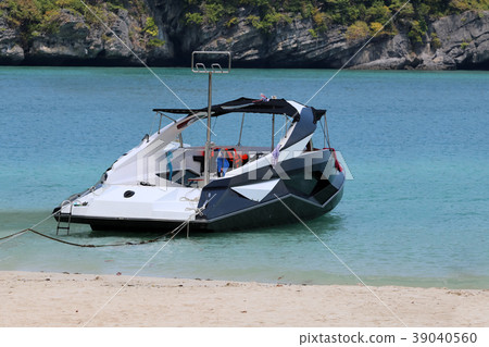 Speed boat with strangely shape near the beach. 39040560