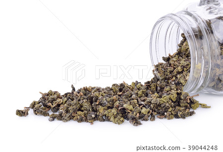 Tea leaves in a glass jar isolated  39044248