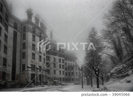 ancient hotel abandoned under a heavy snowfall ancient hotel abandoned under a heavy snowfall 39045066