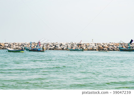 Fishing boat park over sea rock bearer 39047239