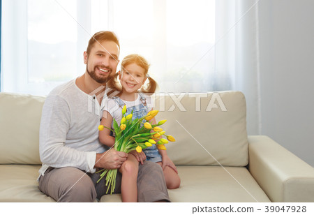 father and child daughter with a bouquet of flowers father and child daughter with a bouquet of flowers 39047928