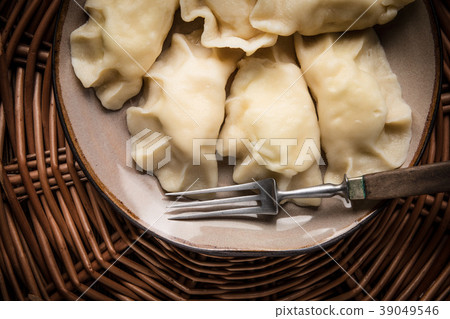 Homemade dumplings with cheese. Homemade dumplings with cheese. 39049546