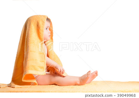 Little girl wrapped in yellow towel, isolated on 39049968