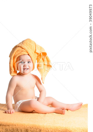 Little girl wrapped in yellow towel, isolated on 39049973