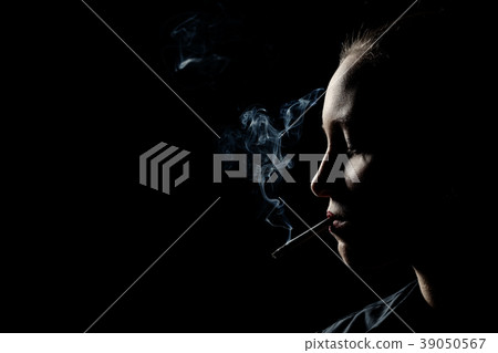 woman smoking cigarette woman smoking cigarette 39050567