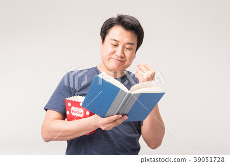 Morning, middle age, reading, popcorn Morning, middle age, reading, popcorn 39051728