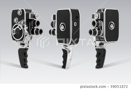 Old Vintage cinema camera 8mm at gray background Old Vintage cinema camera 8mm at gray background 39051872
