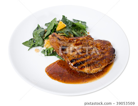 Grilled pork fillet with spinach salad. 39053509