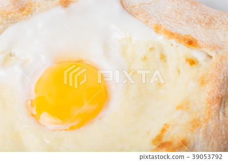 Georgian khachapuri pie with egg and cheese. Georgian khachapuri pie with egg and cheese. 39053792