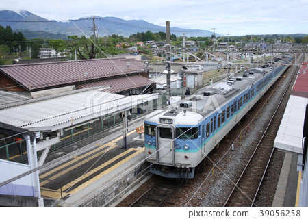 Chuo Line 115 series Nagano train waiting for the express train to pass at Hinoharu Station 39056258