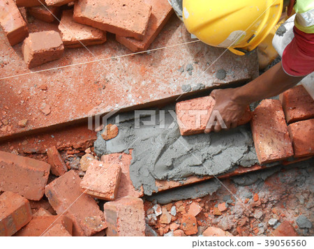 Erecting clay brick wall Erecting clay brick wall 39056560