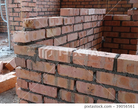 Erecting clay brick wall Erecting clay brick wall 39056561