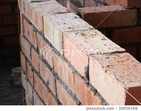 Erecting clay brick wall Erecting clay brick wall 39056566