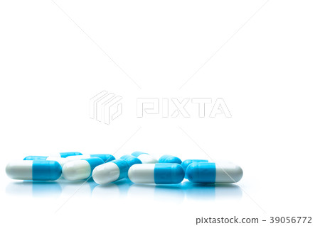 Pile of blue and white capsules pills isolated  39056772