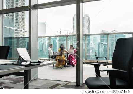 Indian employees during break on the terrace of a Indian employees during break on the terrace of a 39057456