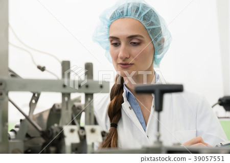 Portrait of woman quality inspector during work in 39057551