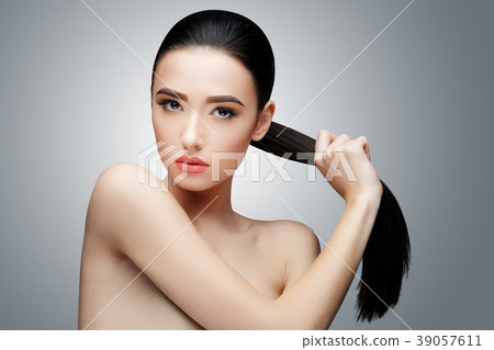 Brunette asian girl with long straight hair Brunette asian girl with long straight hair 39057611