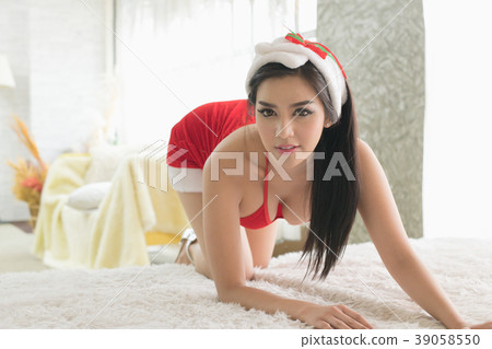 New Year concept. Beautiful happy woman in sexy Santa Claus clot New Year concept. Beautiful happy woman in sexy Santa Claus clot 39058550