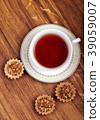 Cup of tea with cakes on a wooden background 39059007