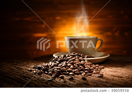 Cup of coffee with smoke and coffee beans Cup of coffee with smoke and coffee beans 39059558