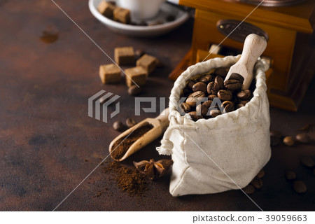 Coffee grinder , cup of coffee and coffee beans 39059663