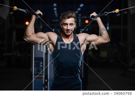 Handsome model young man workout in gym 39060798
