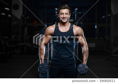 Handsome model young man workout in gym 39060811
