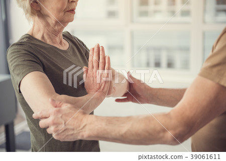 Yoga instructor helping with exercise 39061611