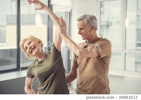 Contented couple stretching together at studio 39061612