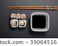 sushi rolls with soy and chopsticks 39064516