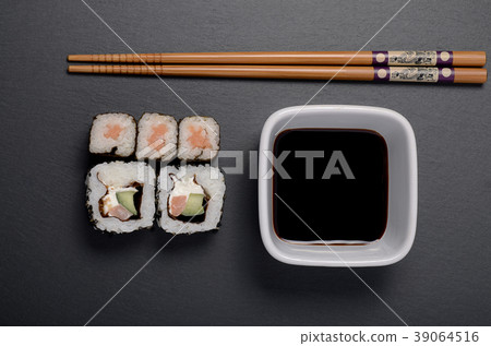 sushi rolls with soy and chopsticks 39064516
