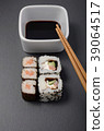 sushi rolls with soy and chopsticks 39064517