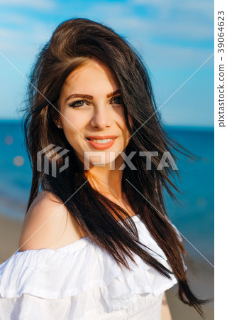 Woman in hat and white dress Woman in hat and white dress 39064623