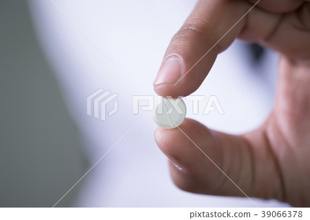 pills and medicines in the hand pharmaceutical  39066378