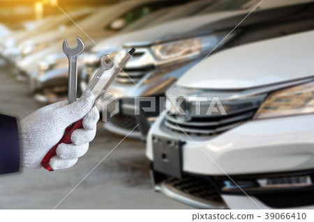 Mechanic repairing a car in garage Auto repair Mechanic repairing a car in garage Auto repair 39066410