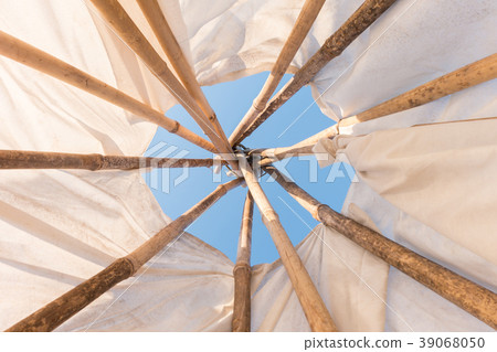 Look up in sky inside Native American Indian tepee Look up in sky inside Native American Indian tepee 39068050